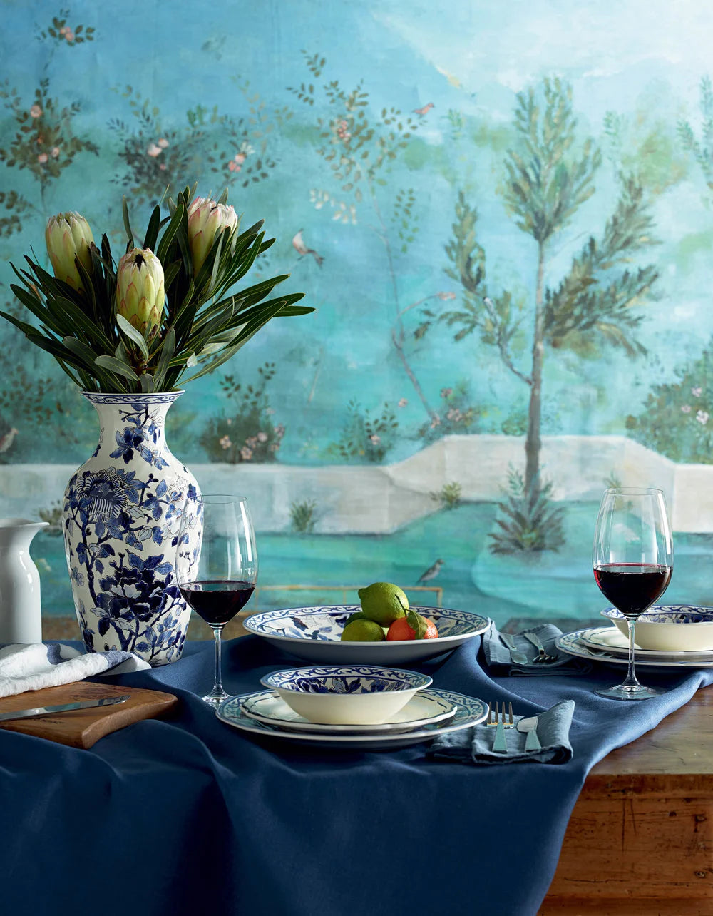 Interior and table styling by Ida Jacobsson-Wells for Harrods, featuring blue and white tableware and floral styling