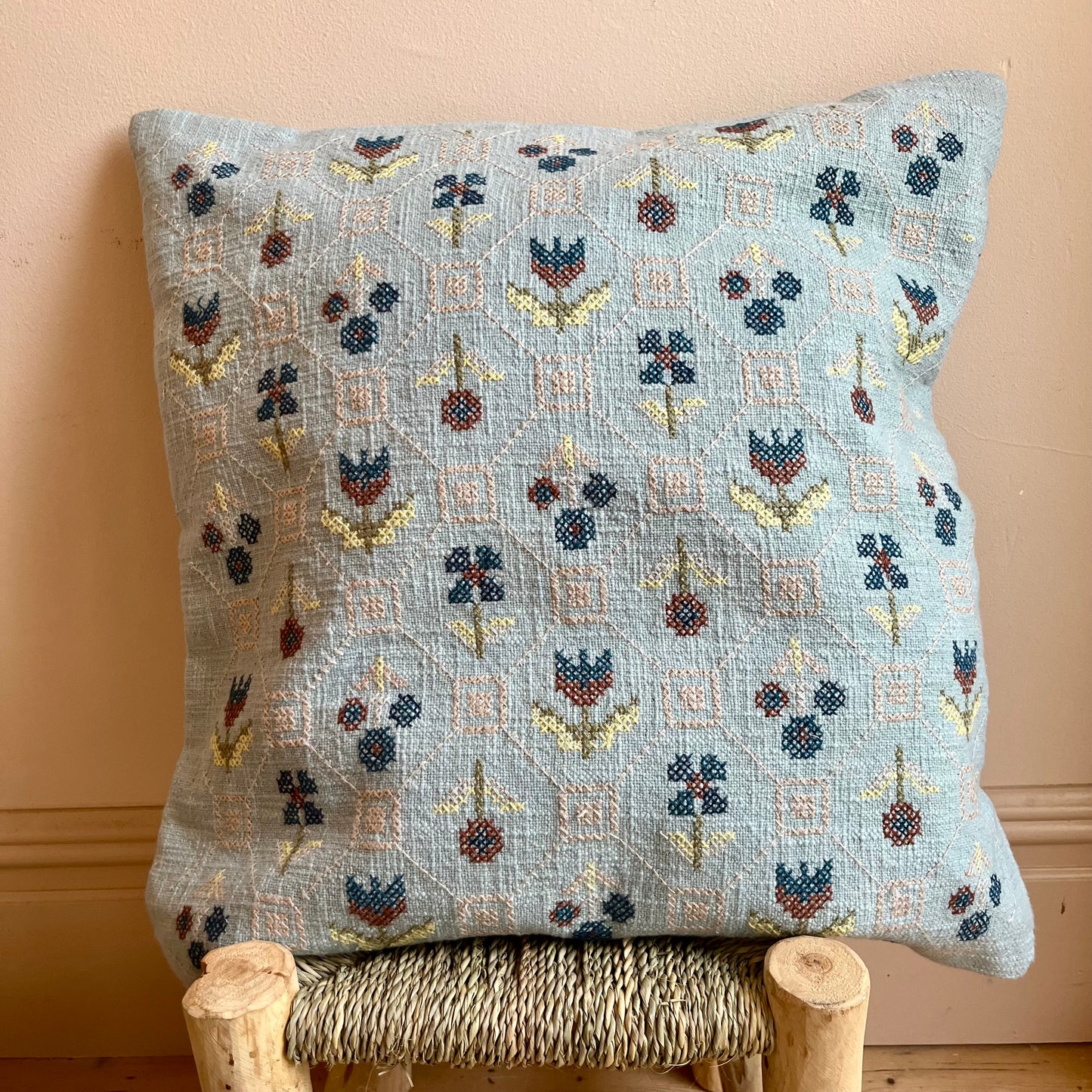 Hand-embroidered floral cushion cover