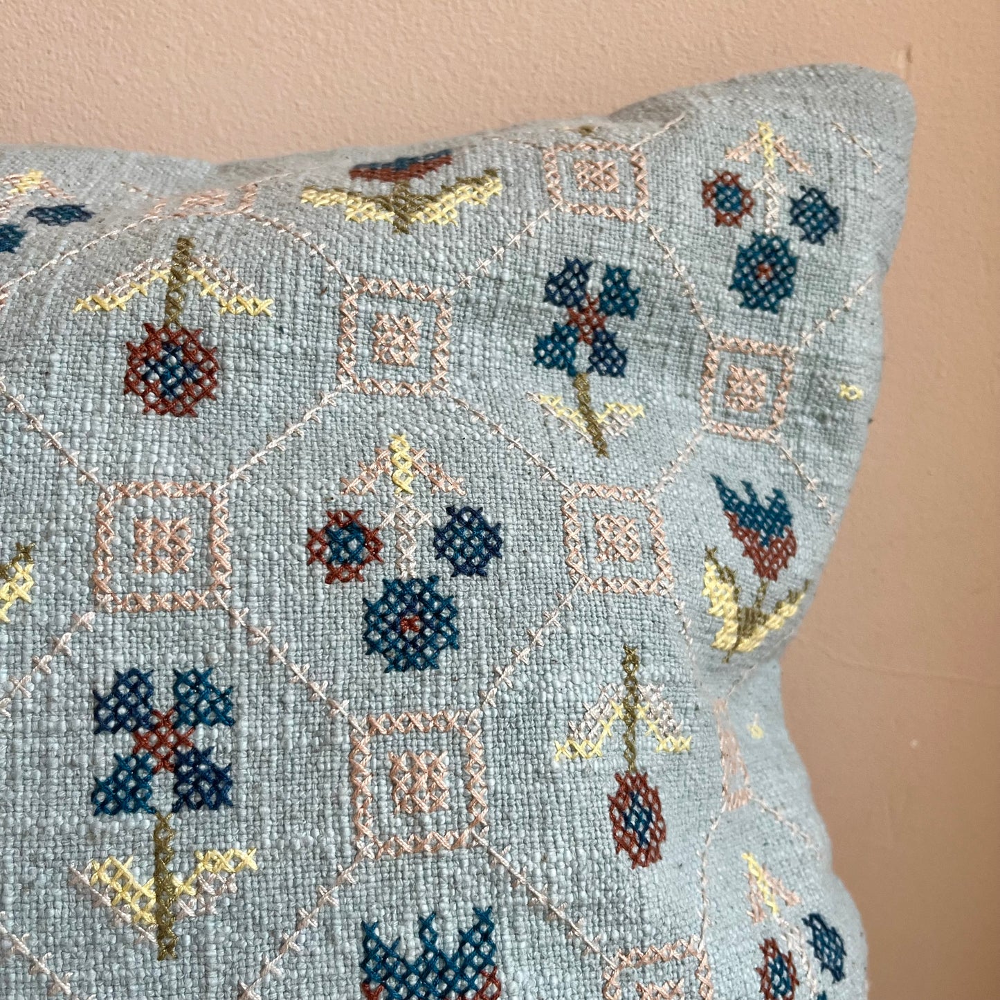 Hand-embroidered floral cushion cover