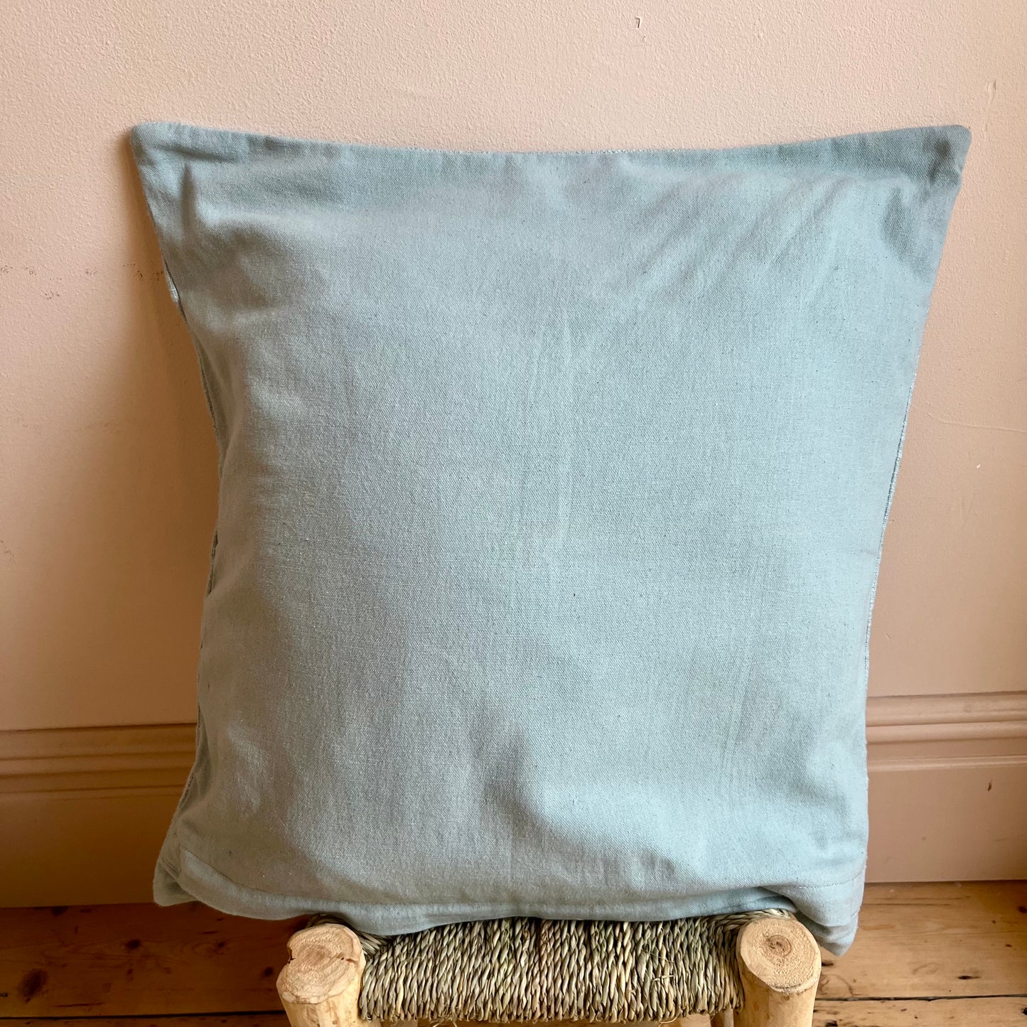 Hand-embroidered floral cushion cover