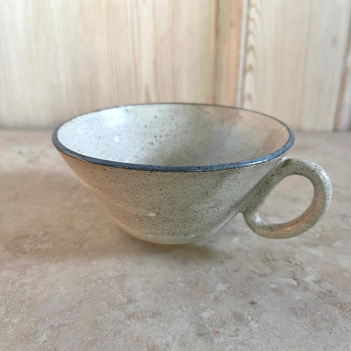 Studio pottery cups with blue rim